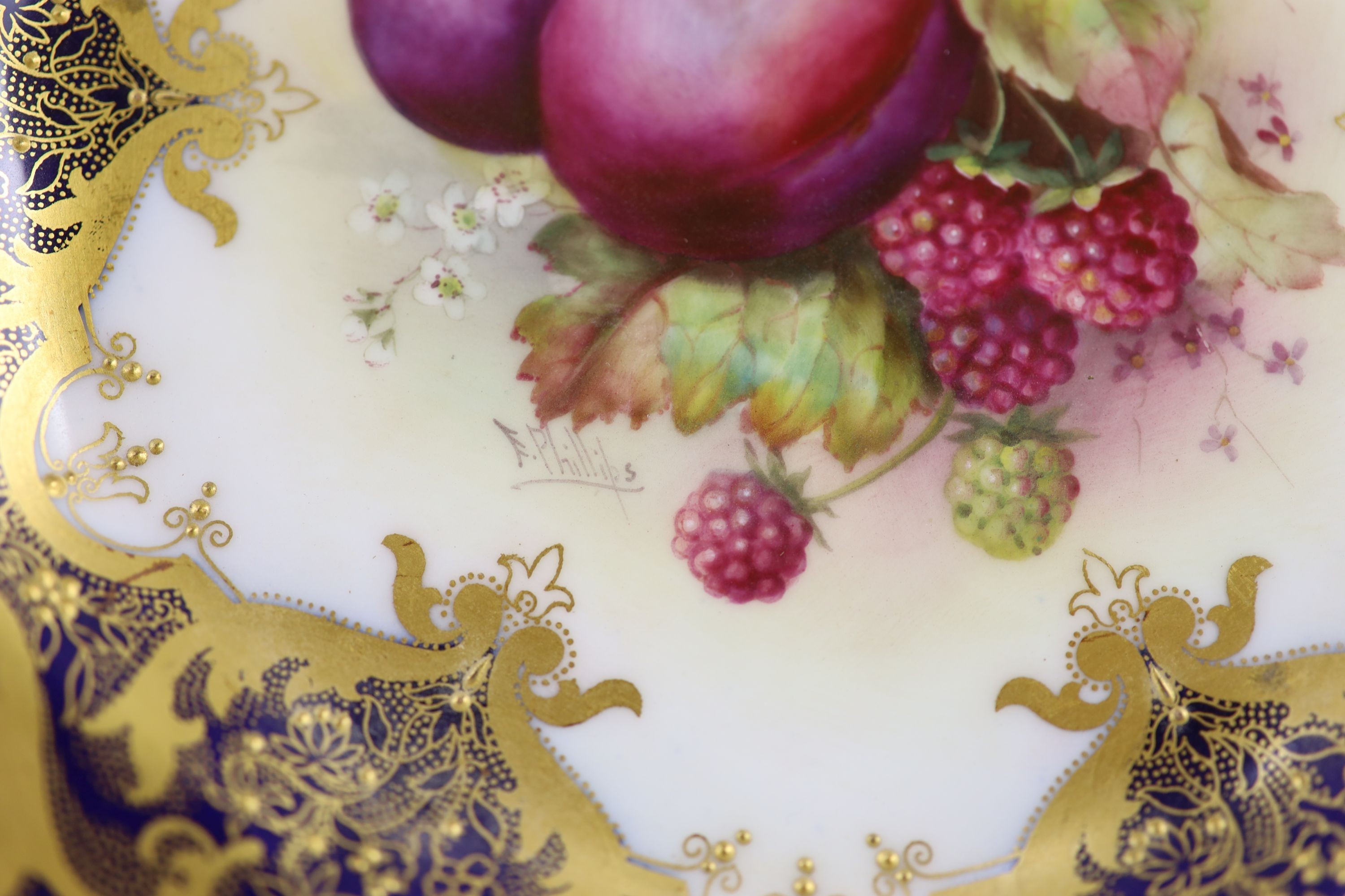 A pair of Royal Worcester fruit painted dessert plates, signed E. Phillips, c.1918, 22.5cm diameter